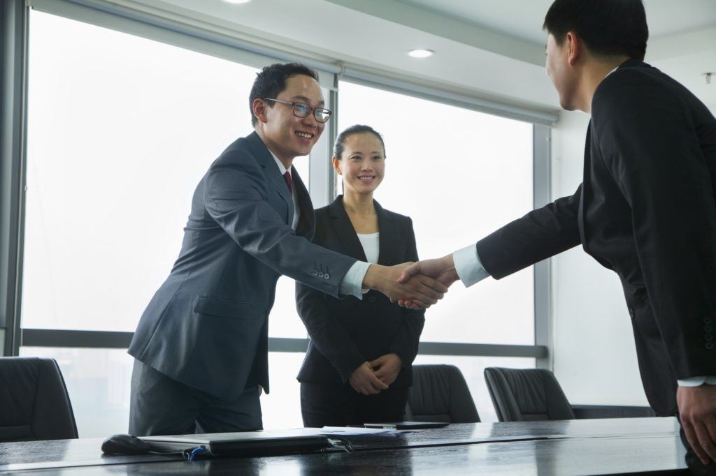 Businessmen Greeting Each Other with a Handshake